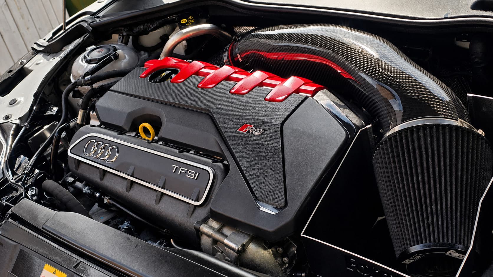 Audi TT RS five-cylinder engine bay with carbon intake cleaned and dressed by Blue Horizon Detailing, Warwickshire