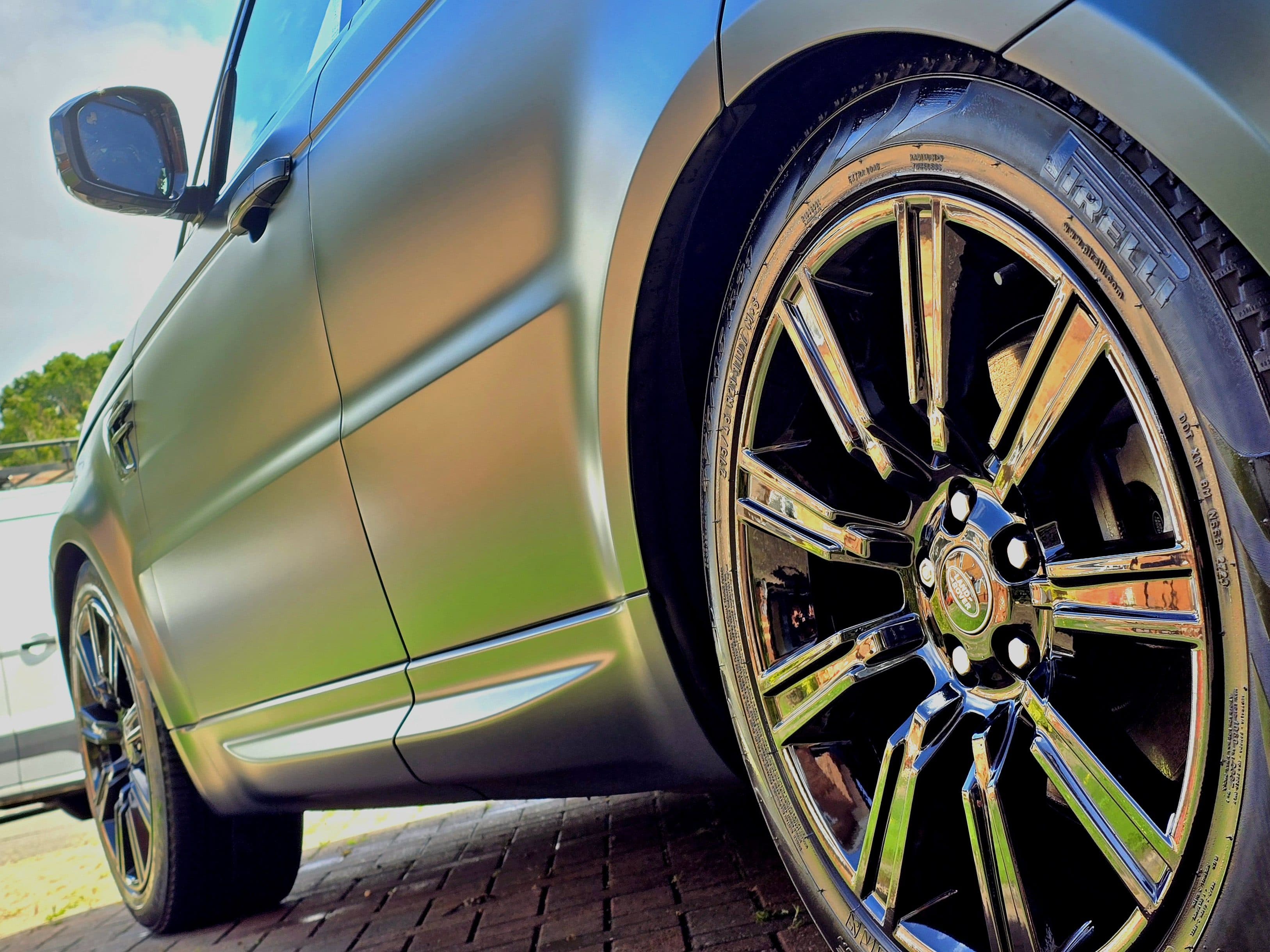 Polished chrome alloy wheel and bodywork close-up on Range Rover Sport — specialist vehicle services by Blue Horizon Detailing, Warwickshire