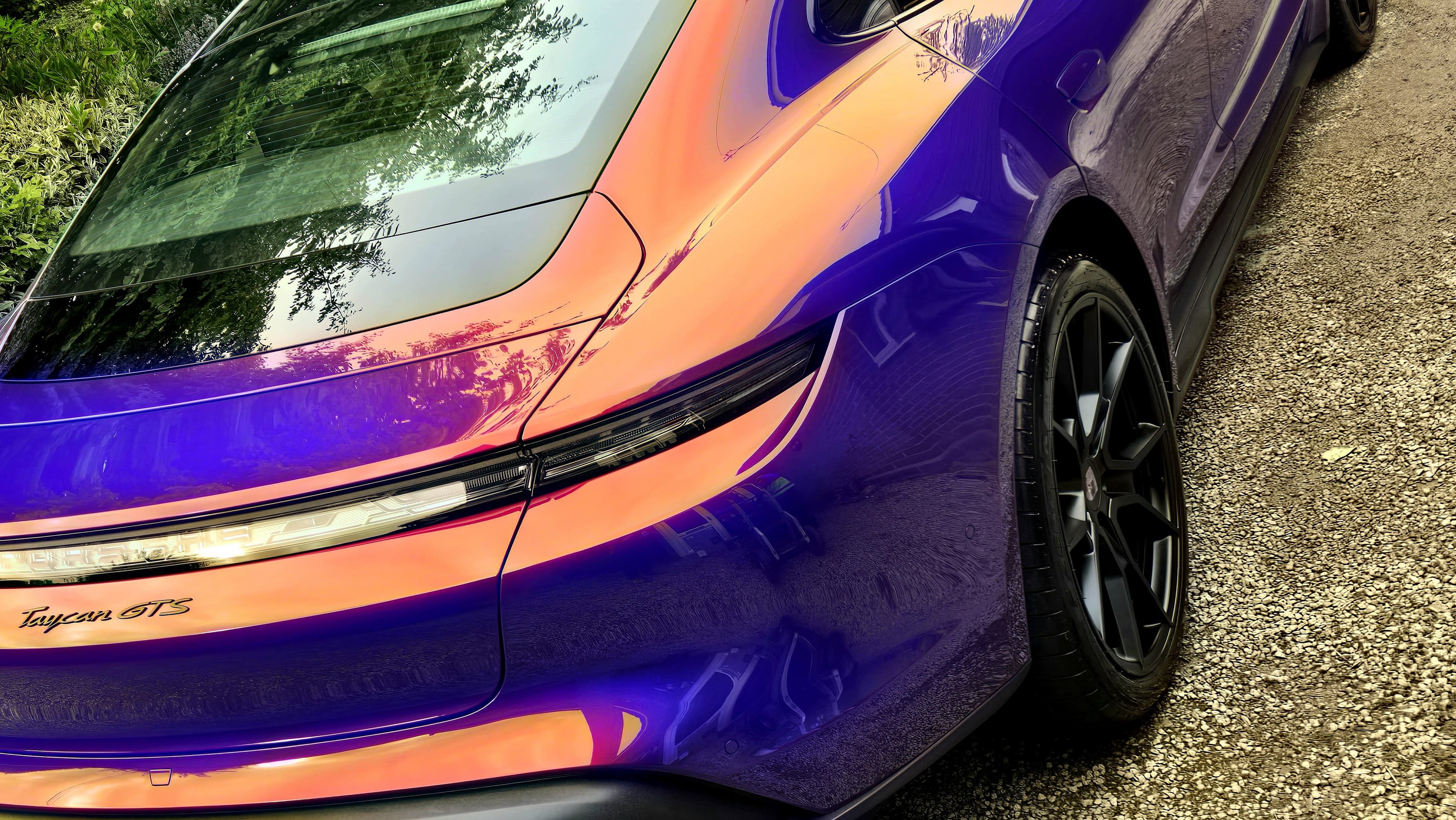 Porsche Taycan GTS rear quarter showing extraordinary iridescent purple and orange paint depth after enhancement detail by Blue Horizon Detailing, Warwickshire