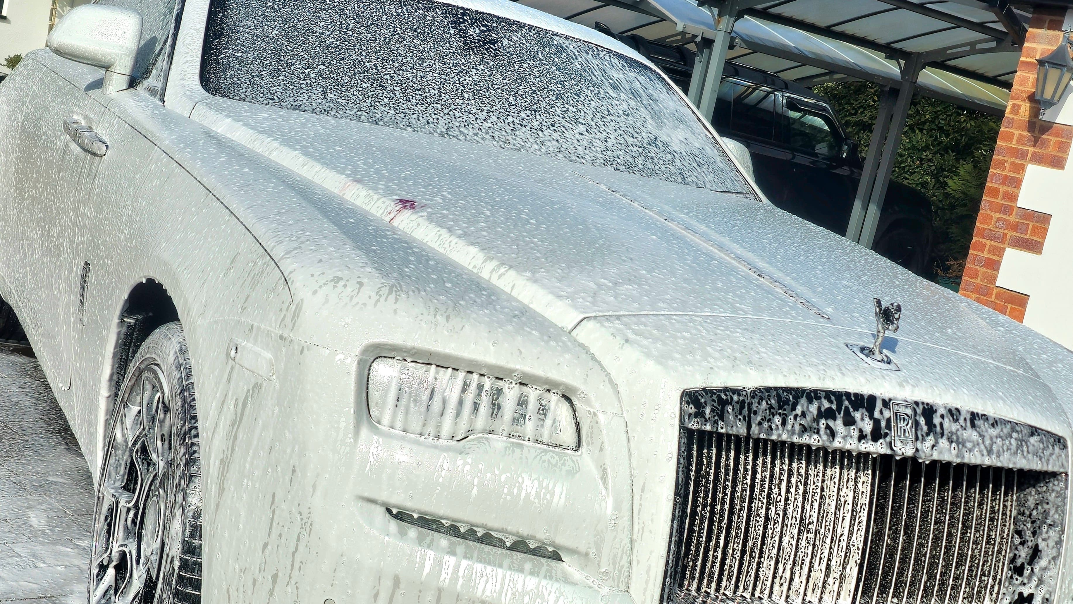 Rolls-Royce Ghost being snow-foamed by Blue Horizon Detailing — professional maintenance valet Warwickshire